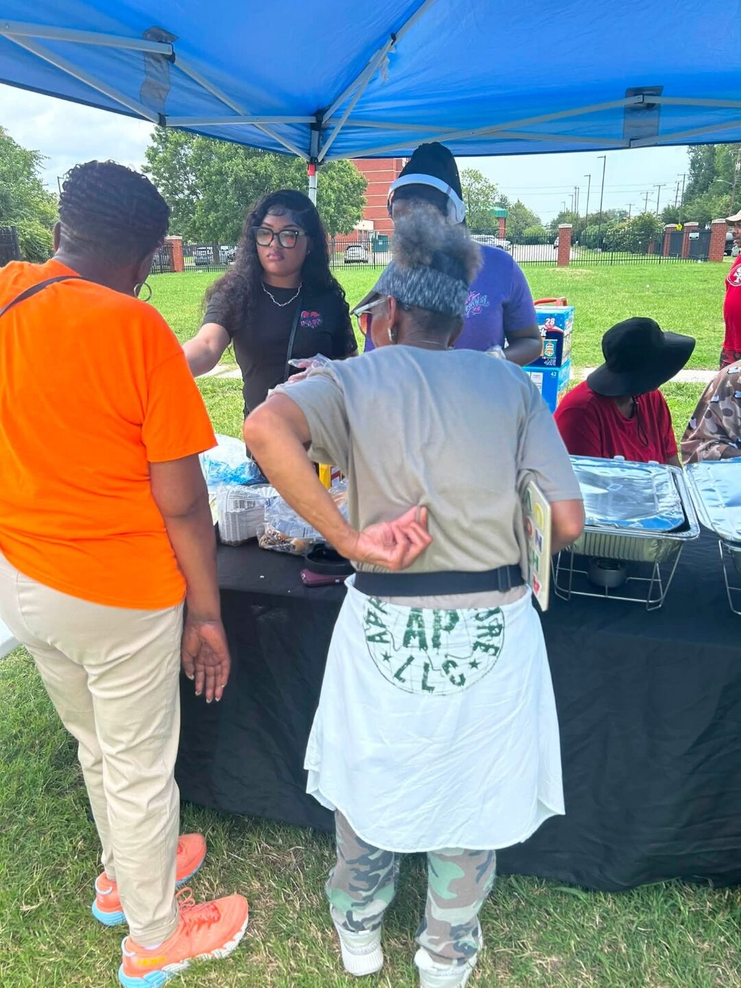 Heavy HeartZ volunteers connecting with community members at an outreach event