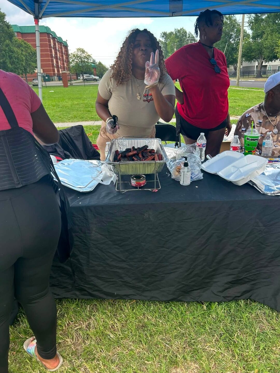 Heavy HeartZ team serving food at an outreach tent