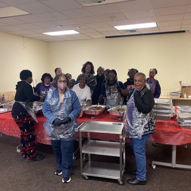 Heavy HeartZ volunteers gathered together during a holiday meal giveaway